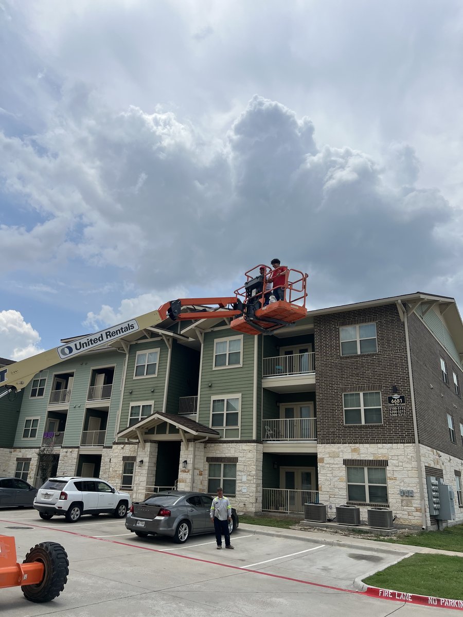 Three-story apartment complex during exterior repaint