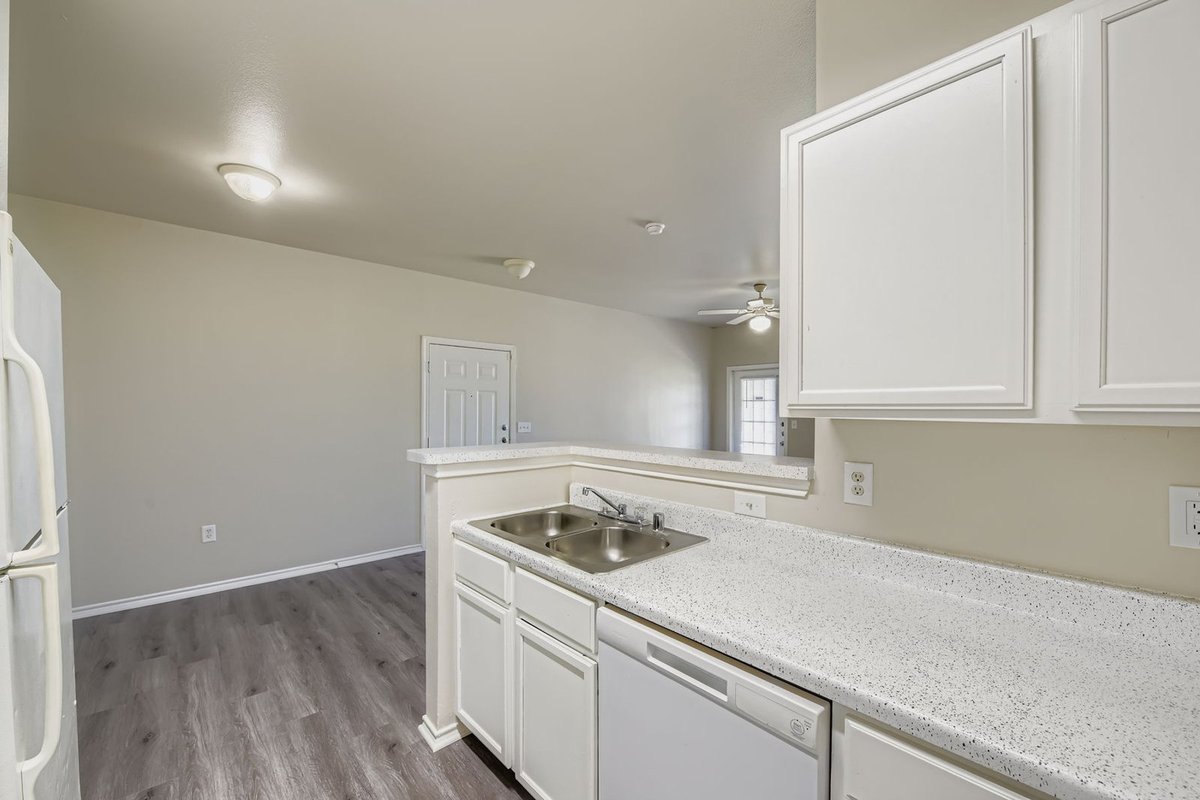 Open-layout apartment kitchen and living area after make-ready